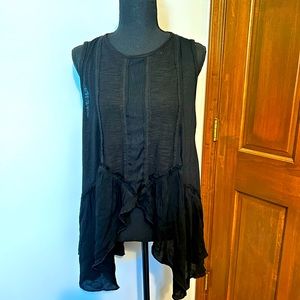 Flowy black POL sleeveless shirt cropped in front and back with ruffles on side